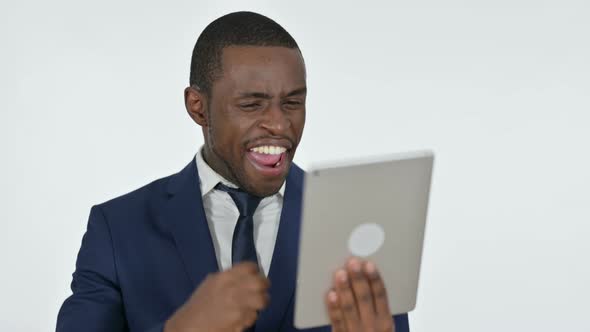 Success on Tablet By African Businessman, White Background