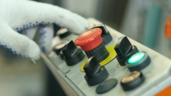 People Push for Buttons on the Plant, Close-up