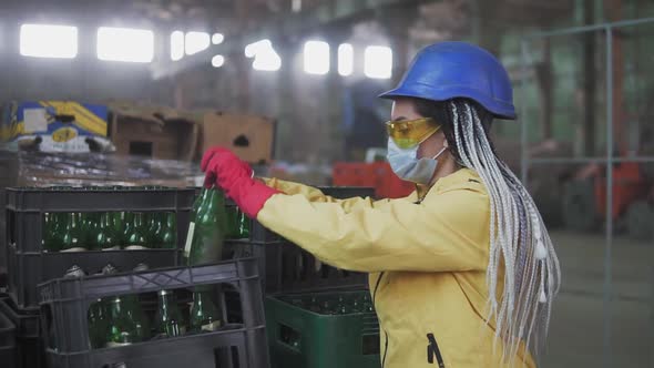 Woman in Mask Working at the Recycle Waste Separation of Recyclable Waste Plants