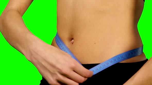 Woman Taking Body Measurements, Sportswear. Details, Green Screen