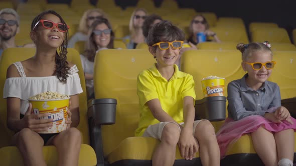 Happy Multiethnic People in 3d Glasses Watching Comedy in Cinema. Portrait of Cheerful Children and