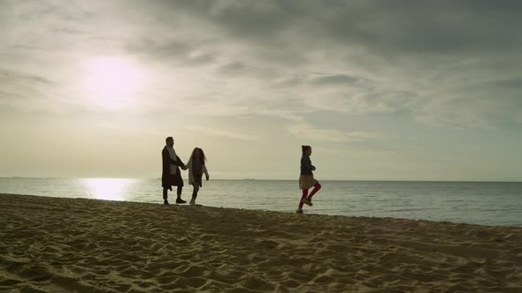 Cheerful Family Going Beach Sunset Sky Ocean