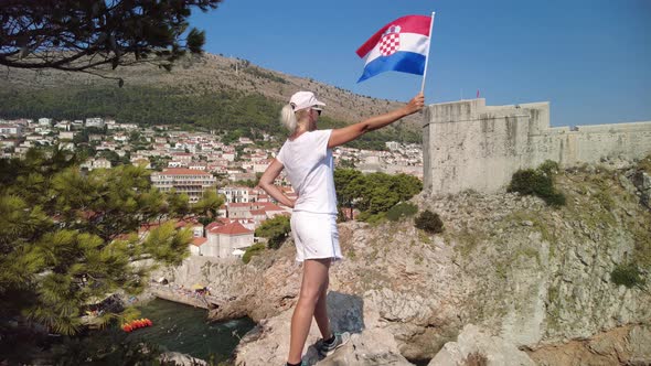 Girl with Croatian Flag on Dubrovnik City Walls