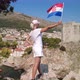 Girl with Croatian Flag on Dubrovnik City Walls - VideoHive Item for Sale