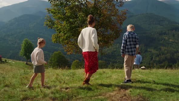 Family Spending Time Nature with Pedigree Pet