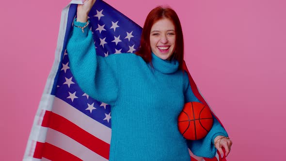 Redhead Young Woman Basketball Fan Holding American USA Flag Doing Winner Gesture Dancing Alone