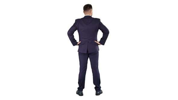 Businessman looking around with hands on hips on white background.