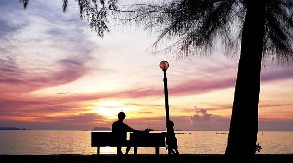 Father and Daughter Against the Sunset