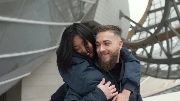 Man and woman hugging outdoors