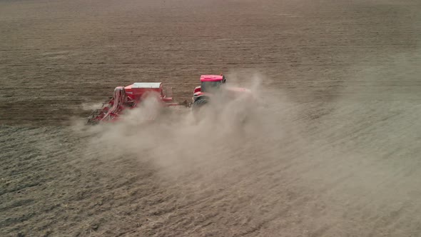 Tractor with a Sowing Unit Sows Grain Crops