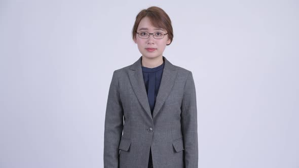 Young Happy Asian Businesswoman with Eyeglasses Smiling