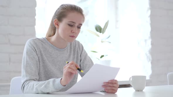 Paperwork Young Woman Working on Documents in Office
