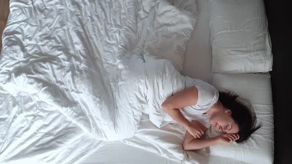 Overhead View Woman Waking Up in Bed