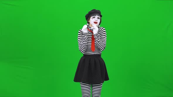 Mime Girl Looking Happy, Smiling, Showing Heart Sign