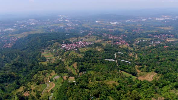 Ambarawa city in Indonesian green countryside, Central Java. Aerial forward