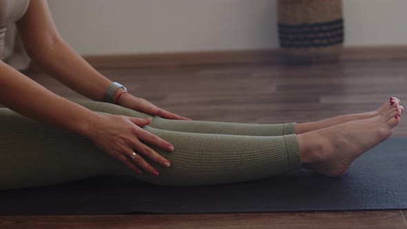 Woman in Sportswear Does Morning Stretching on Yoga Mat Side View