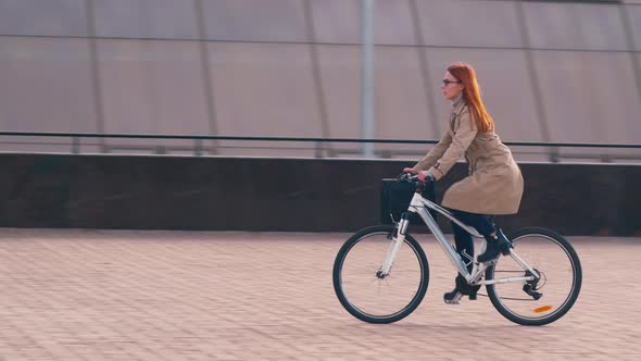 Businesswoman riding a bike