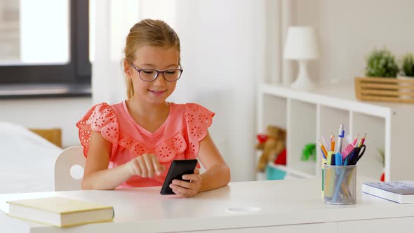 Student Girl Using Smartphone at Home