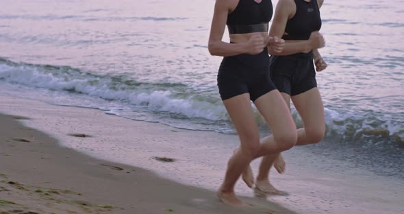 Closeup Running Legs of a Two Ladies Through the