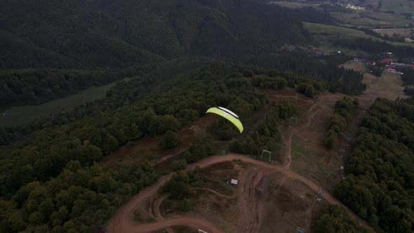 Following After Paraglider Flying Above Ukrainian Carpathian Mountains