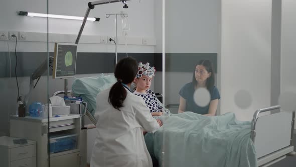 Sick Girl Child Patient Wearing Egg Headset with Sensors