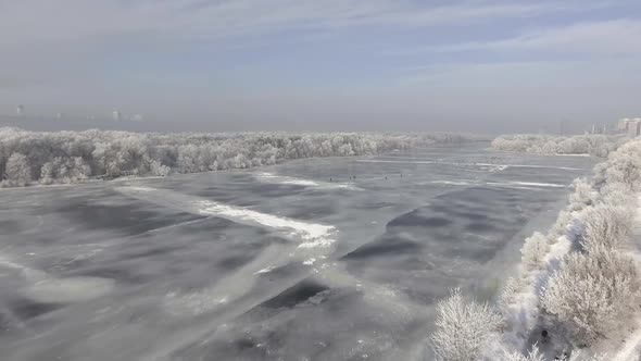 The Frozen River in the Forest in Winter, the Snow on the Trees, the View From the Air