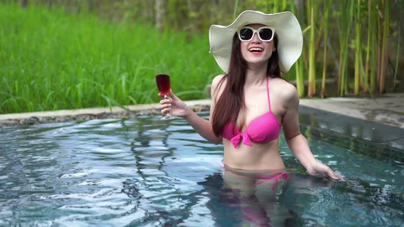happy woman in swimming pool