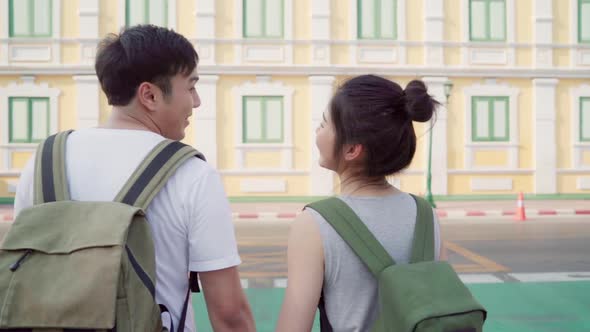 Traveler Asian couple traveling and walking in Bangkok, Thailand.