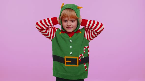 Girl Kid Christmas Elf Covering Ears and Gesturing No Avoiding Advice Ignoring Unpleasant Noise