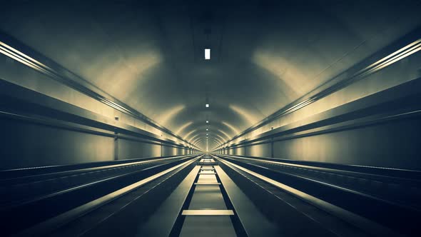 Seamless subway journey through the modern underground empty railway tunnel.