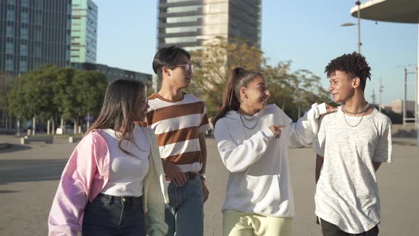 Teenage Multiracial Student Friends Have Fun Together Hanging Out in a Modern City