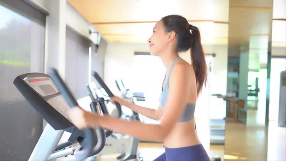 Woman run on treadmill in gym