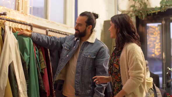 Couple Choosing Clothes at Vintage Clothing Store 5