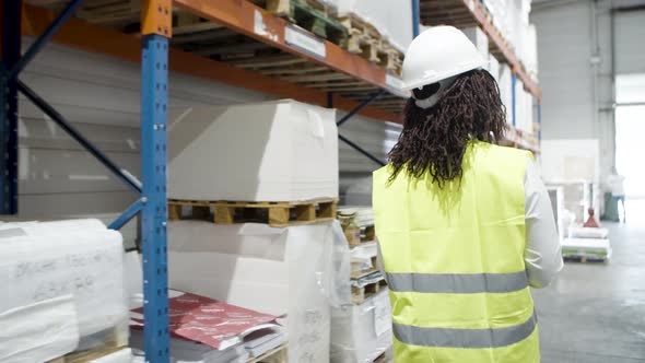 Worker of Logistic Company Counting Goods