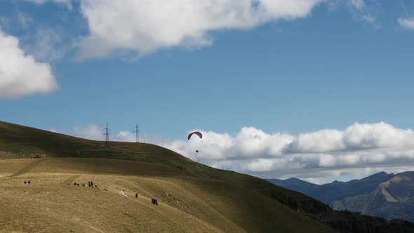 People watching paragliding