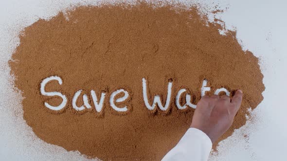 Hand Writes On Soil  Save Water