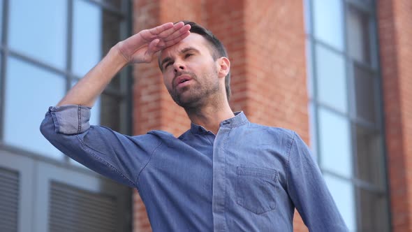 Searching Gesture By Casual Man in Office