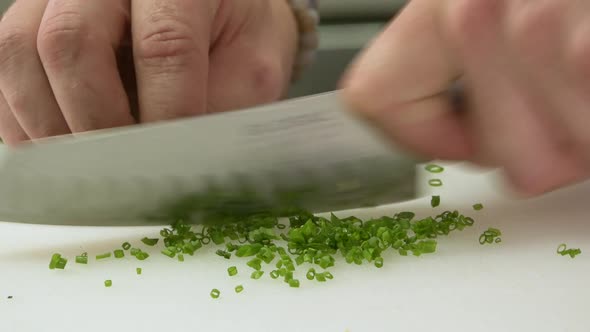 Our Chef chops green onion in real time. The shooting is raw, more reality cooking competition style