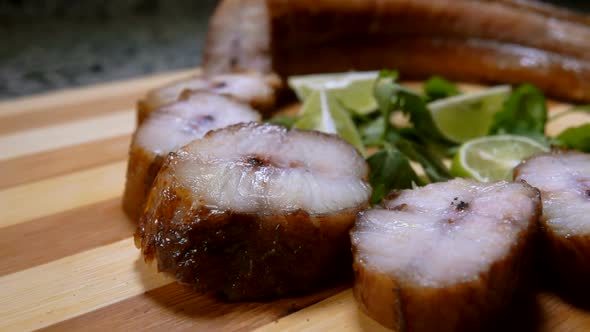 Close-up Camera Movement in Pieces of Smoked Eel