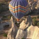 Large Hot Air Balloon Flies Over Bare Rocky Stone Pillars - VideoHive Item for Sale