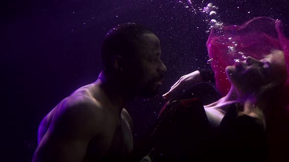 Sexy People Underwater, Man Is Embracing Beloved Woman, Passionate Dating