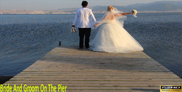 Bride And Groom On The Pier