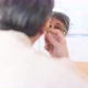 Woman massaging face during skincare procedure - VideoHive Item for Sale