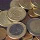Closeup of European Union Currency Euro or EUR Coins on a Dark Slate Plate Background - VideoHive Item for Sale