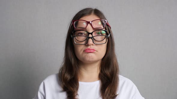 Woman Puts on Several Glasses to Improve Bad Eyesight