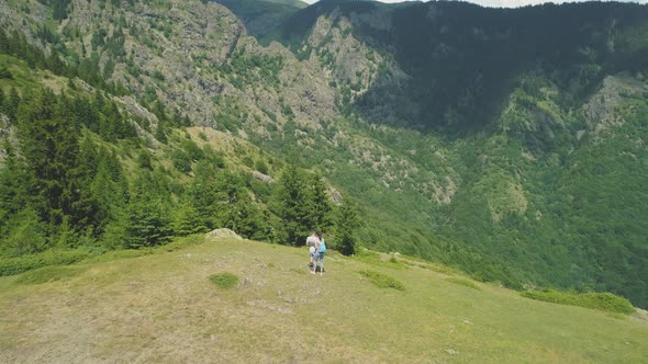 Hikers Enjoying the View From Mountain Summit