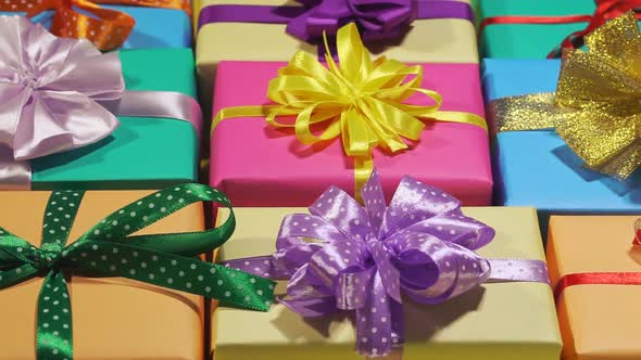 A Lot Of Holiday Gifts In A Beautiful Package With Ribbon Bows