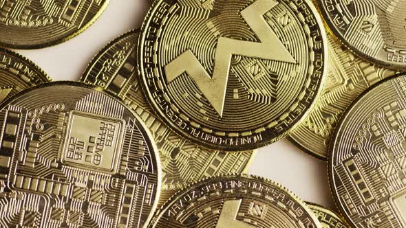 Rotating shot of Bitcoins (digital cryptocurrency) - BITCOIN MONERO 