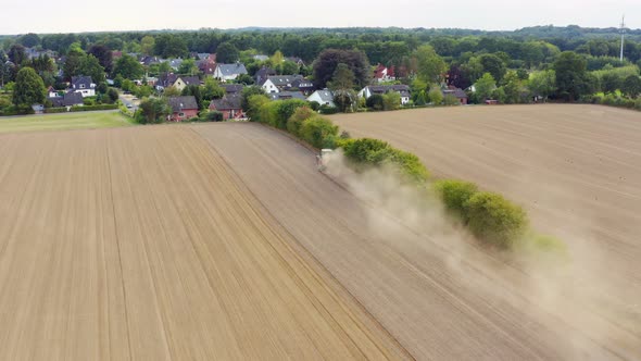 Aerial view of an agriculture field with tractor