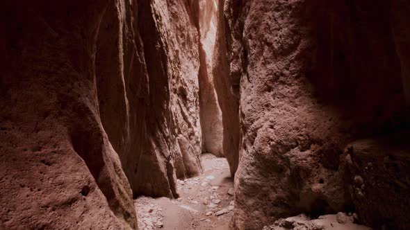 Drone Flying Through Narrow Canyon in Mountains